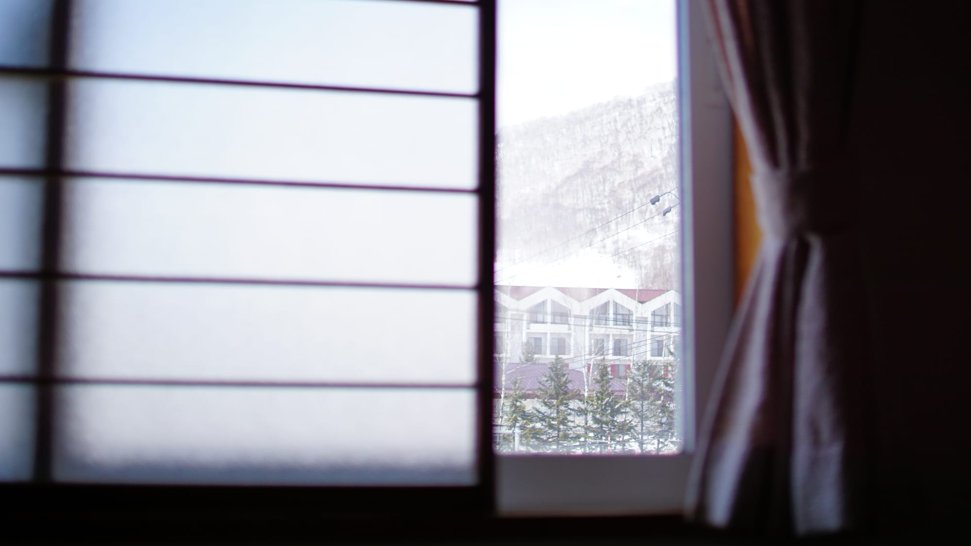 A foggy window looking out over a quiet street